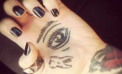 olho na mão fotos de tatuagens